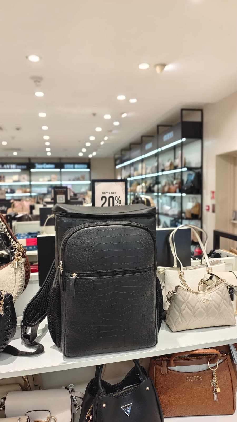 BACKUP bags displayed at a store front